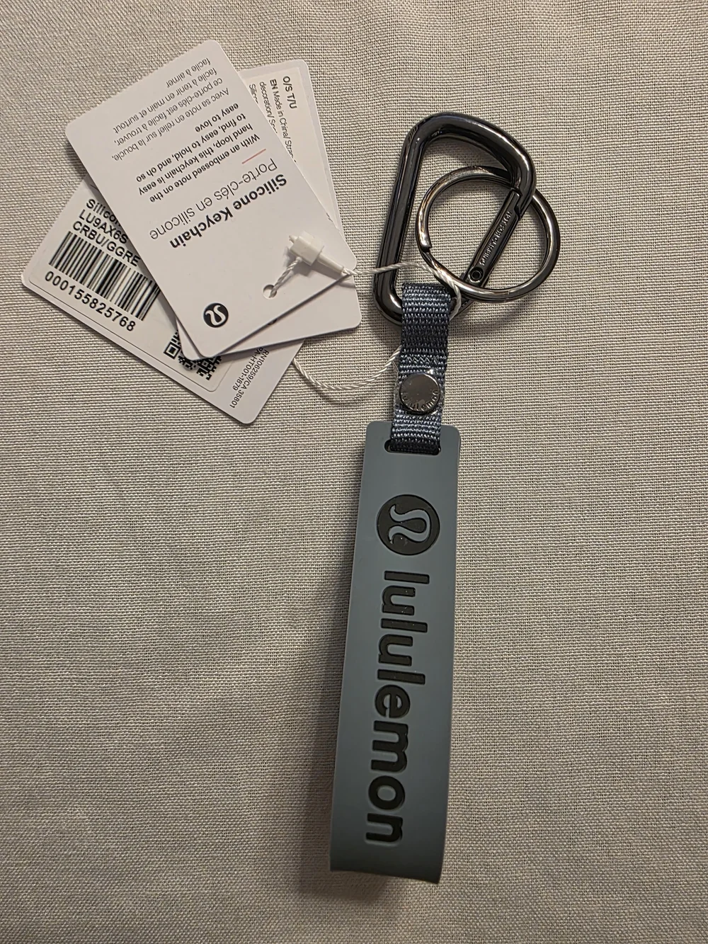 lululemon athletica Silicone Key Fob in Gray-Blue with Metal Ring.